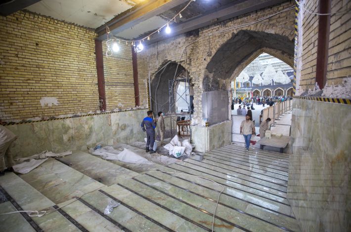 Finishing the floor cladding of the Imam Al-Hassan Gate (peace be upon him).